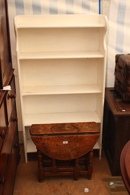 Appraisal: A WHITE PAINTED OPEN FRONT BOOKSHELF with five fitted shelves