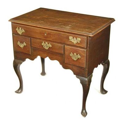 Appraisal: A George II mahogany lowboy the moulded edge top above