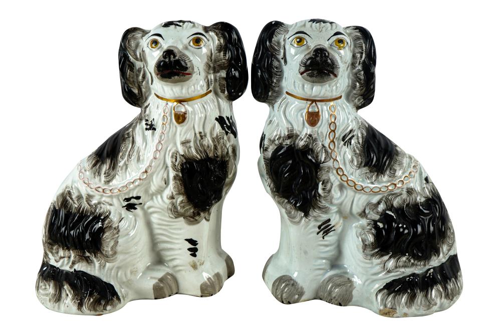 Appraisal: PAIR OF STAFFORDSHIRE POTTERY SPANIEL DOGSunmarked Condition with rubbed losses