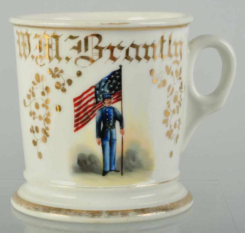 Appraisal: Soldier in Uniform with US Flag Shaving Mug Description Gilt