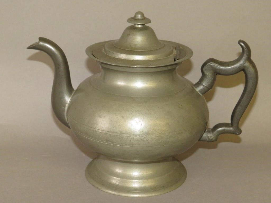 Appraisal: AMERICAN R I BRITANNIA TEAPOTca American Britannia baluster teapot with