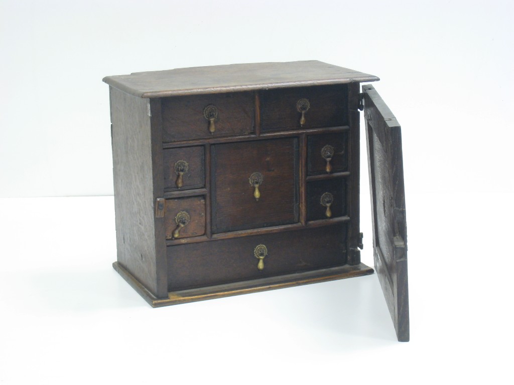 Appraisal: An th Century oak Spice Cabinet with single panelled door