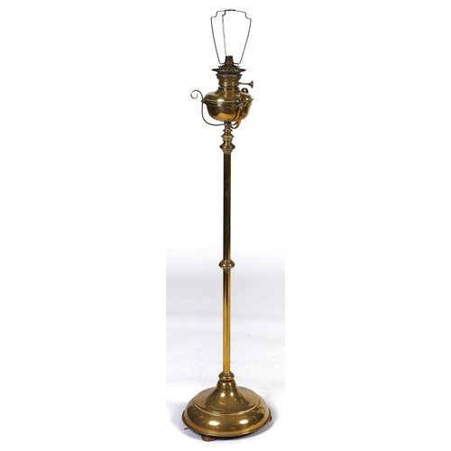 Appraisal: A Victorian brass telescopic oil lamp with scroll mounted reservoir