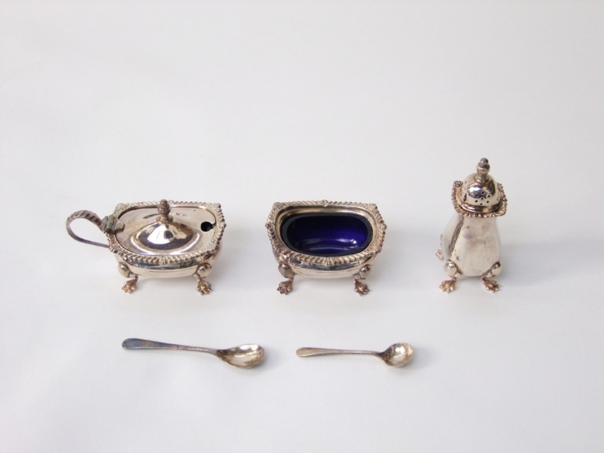 Appraisal: A three piece silver condiment set in a Georgian style