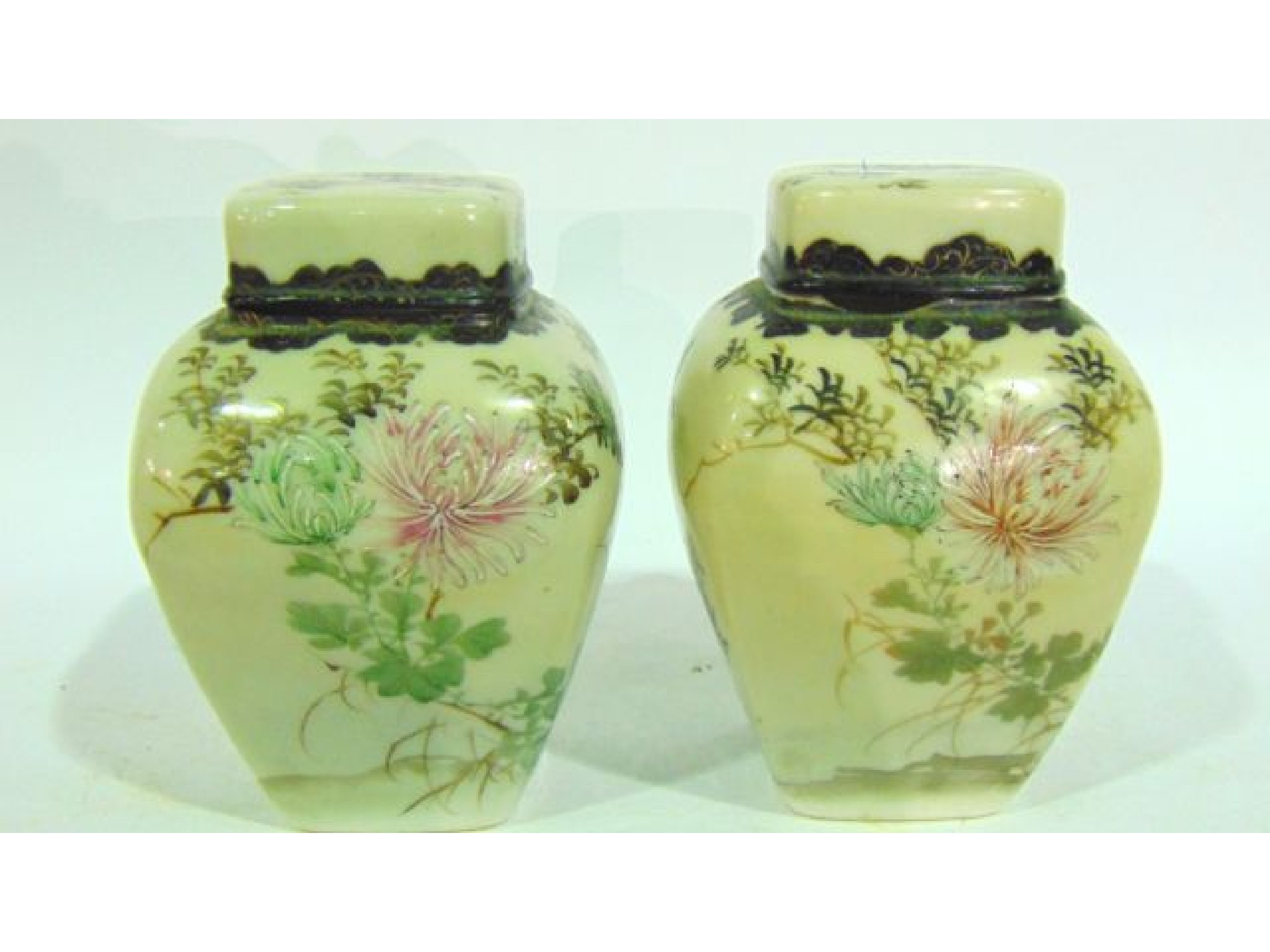 Appraisal: A pair of oriental four sided caddies and covers with