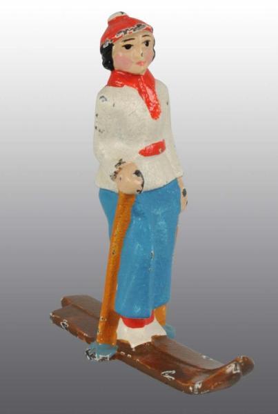 Appraisal: Cast Iron Hubley Girl Skier Paperweight Description Cat Condition Excellent