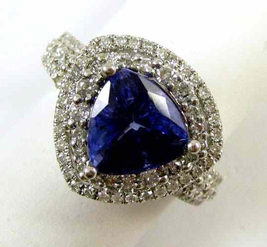 Appraisal: TANZANITE DIAMOND AND FOURTEEN KARAT GOLD RING with round-cut diamonds