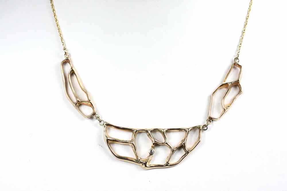 Appraisal: NECKLACE - K yellow gold and diamond necklace with hand