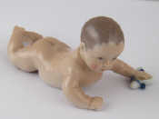 Appraisal: A Royal Copenhagen ceramic figure of a naked baby approx