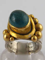 Appraisal: A silver and yellow metal test high carat gold emerald