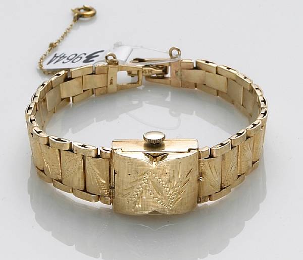 Appraisal: A lady's k gold covered integral bracelet wristwatch Swiss signed