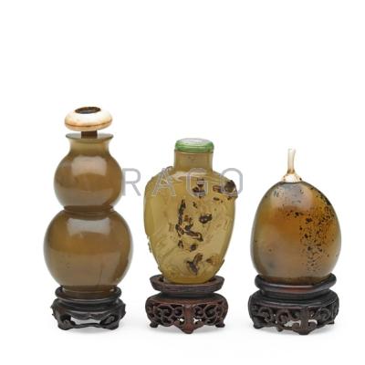 Appraisal: CHINESE AGATE SNUFF BOTTLES Three all with lids and bases