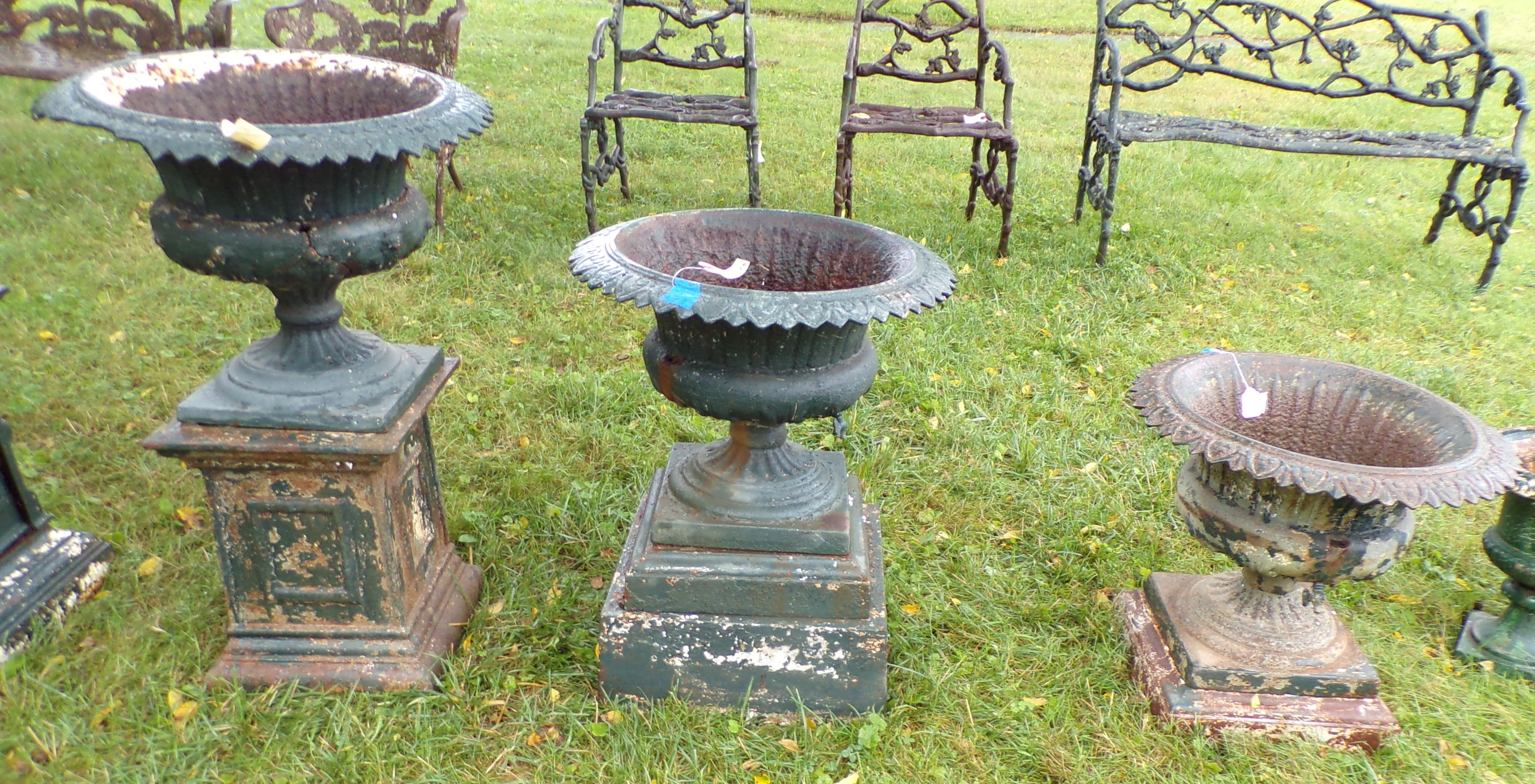 Appraisal: Set of cast iron garden planters on stands not matching