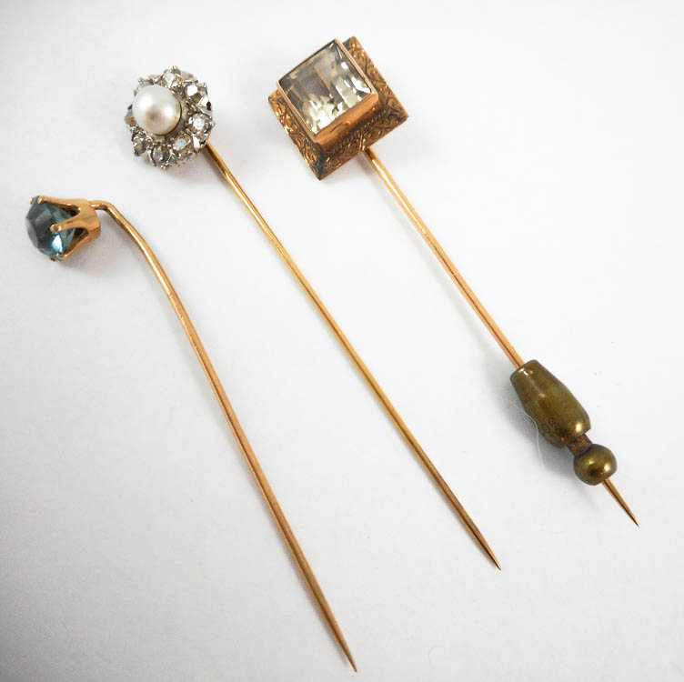 Appraisal: COLLECTION OF THREE YELLOW GOLD STICK PINS including a k