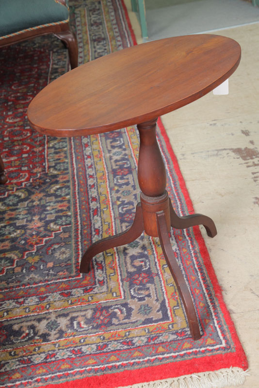 Appraisal: TILT TOP CANDLESTAND Walnut with an oval top turned pedastal