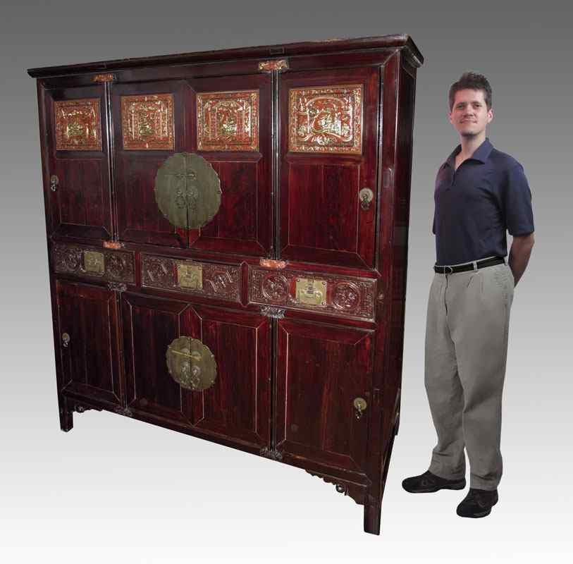 Appraisal: CHINESE EIGHT DOOR CABINET The upper four doors with carved