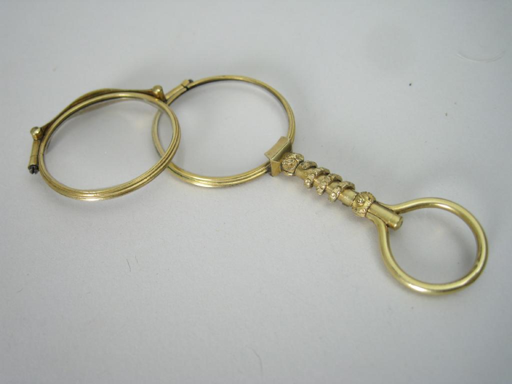 Appraisal: Pair of gilt metal Lorgnettes with rope twist decorated handle