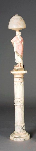 Appraisal: An Art Deco alabaster figural lamp on a marble pedestal