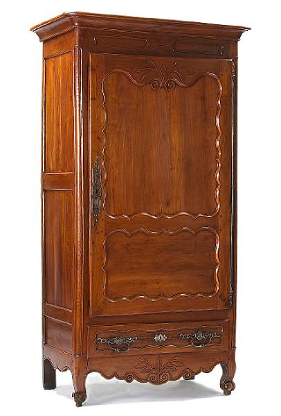 Appraisal: Furniture The outswept cornice over a shaped panel molded door