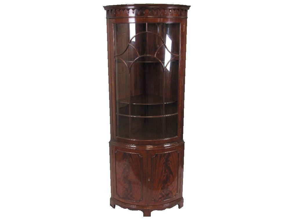 Appraisal: Mahogany bow fronted corner cabinet the glass fronted door revealing