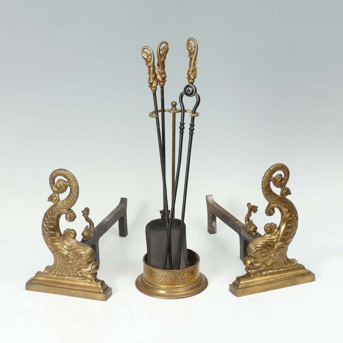 Appraisal: EARLY DOLPHIN ANDIRONS AND FIREPLACE TOOLS Turn of the century