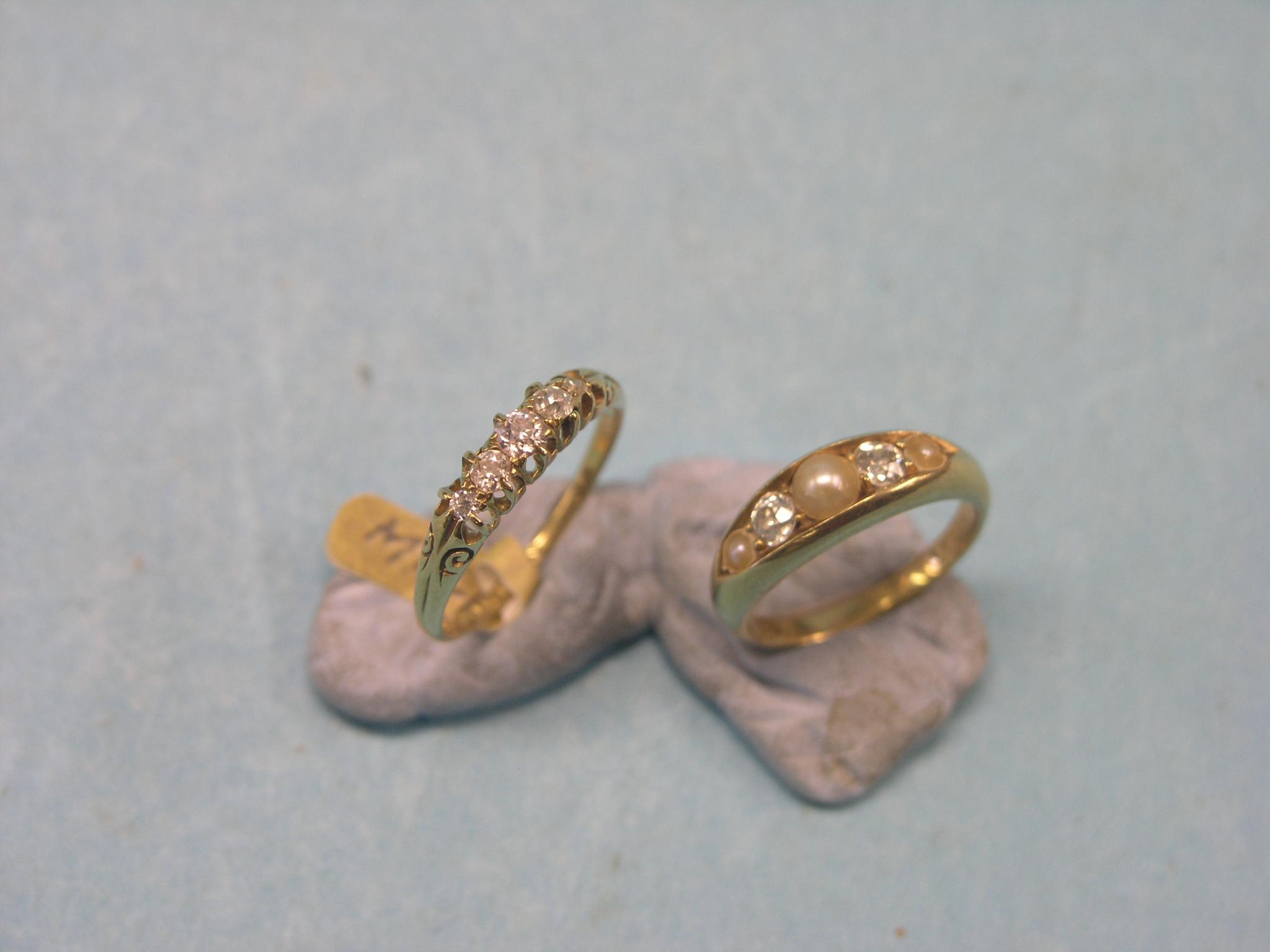 Appraisal: Two ct gold and diamond rings half-hoop claw-set with five