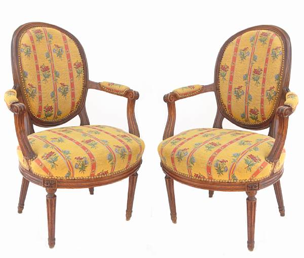 Appraisal: A pair of Louis XVI walnut and upholstered fauteuils height