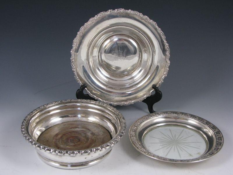 Appraisal: Three Silver Wine Coasters the first with sterling repousse rim