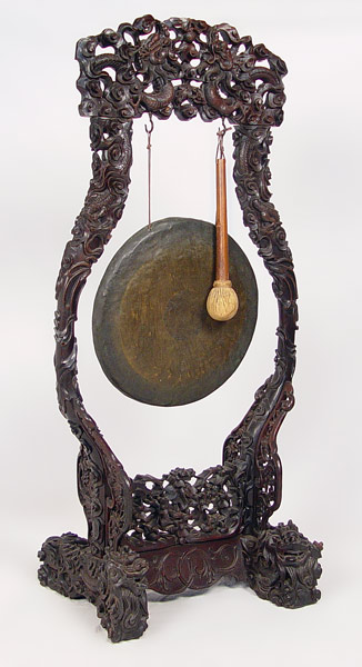 Appraisal: CHINESE BRONZE GONG ON CARVED EBONY FLOOR STAND Measure ''