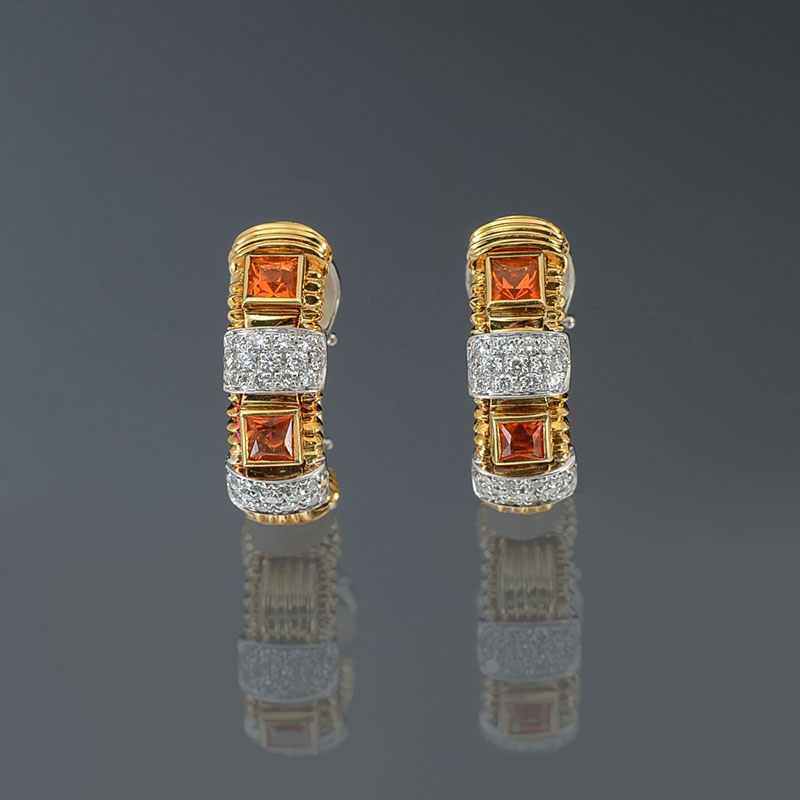 Appraisal: K MANDARIN GARNET DIAMOND EARRINGS round brilliant cut diamonds are