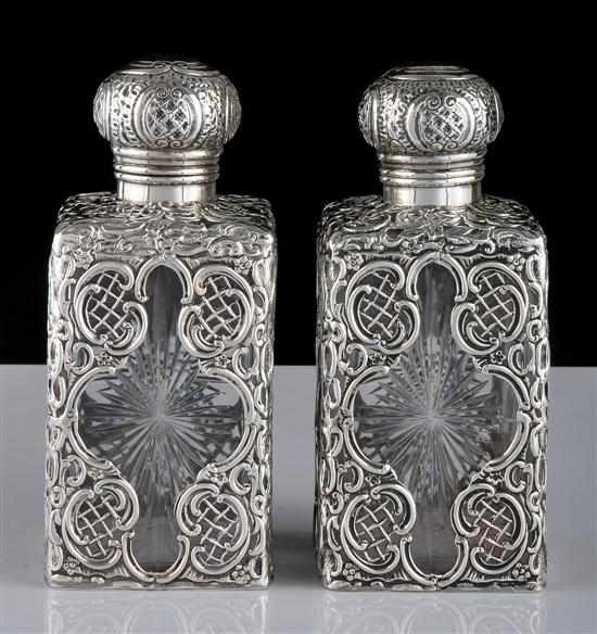 Appraisal: A pair of sterling silver encased glass vanity jars Makers