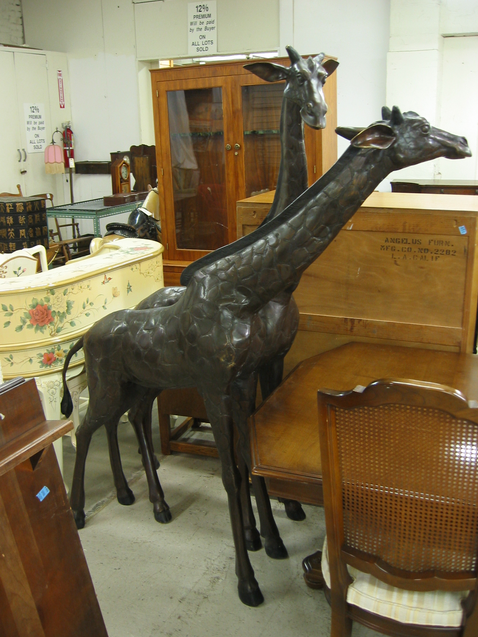 Appraisal: PAIR OF BRONZE AFRICAN WILDLIFE FIGURES two giraffe in individual