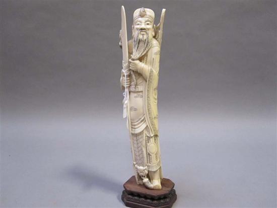 Appraisal: CHINESE CARVED IVORY FIGURE OF A BEARDED WARRIOR Wearing a