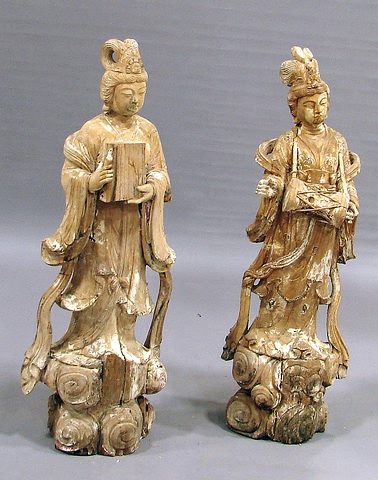 Appraisal: Distressed wood figure standing playing small drum other holding book