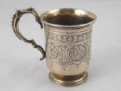 Appraisal: A Victorian silver christening cup in the Gothic revival style