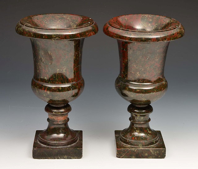 Appraisal: A PAIR OF ITALIANATE SERPENTINE MARBLE URNS of campana form