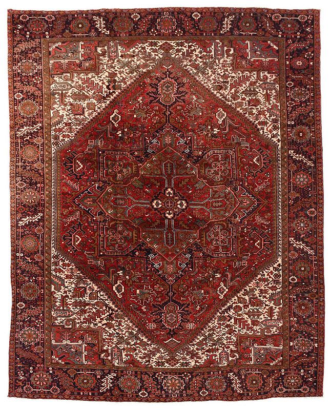 Appraisal: Heriz Carpet Persia th century red field with polygonal medallion