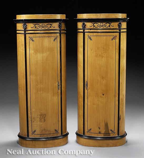 Appraisal: A Pair of Biedermeier-Style Blondewood and Ebonized Pedestal Cabinets height