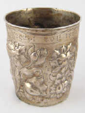 Appraisal: A silver beaker heavily embossed with flowers in the Dutch