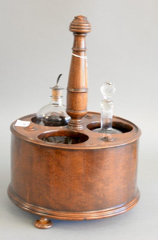 Appraisal: Regency mahogany bottle carrier with circular body cut out for