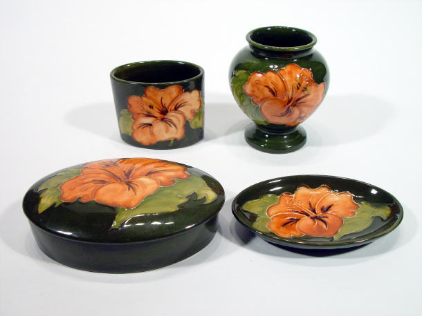 Appraisal: Four Moorcroft pottery coral hibiscus items a vase a trinket