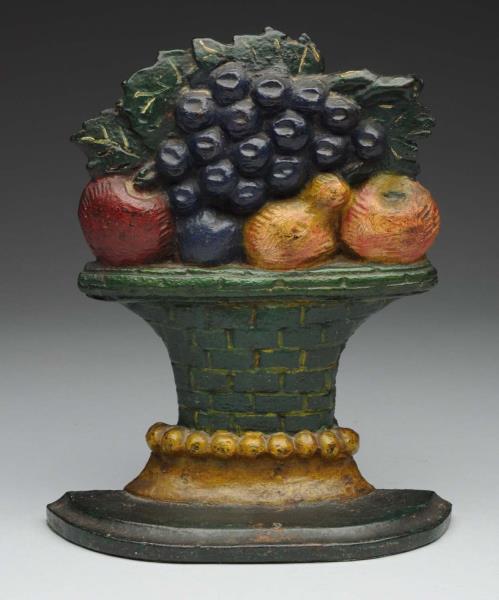 Appraisal: Cast Iron Mixed Fruit in Urn Doorstop Depicts mixed fruit