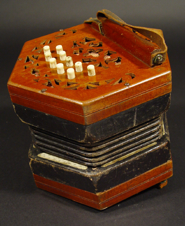 Appraisal: Mahogany and black leather concertina with ivory buttons