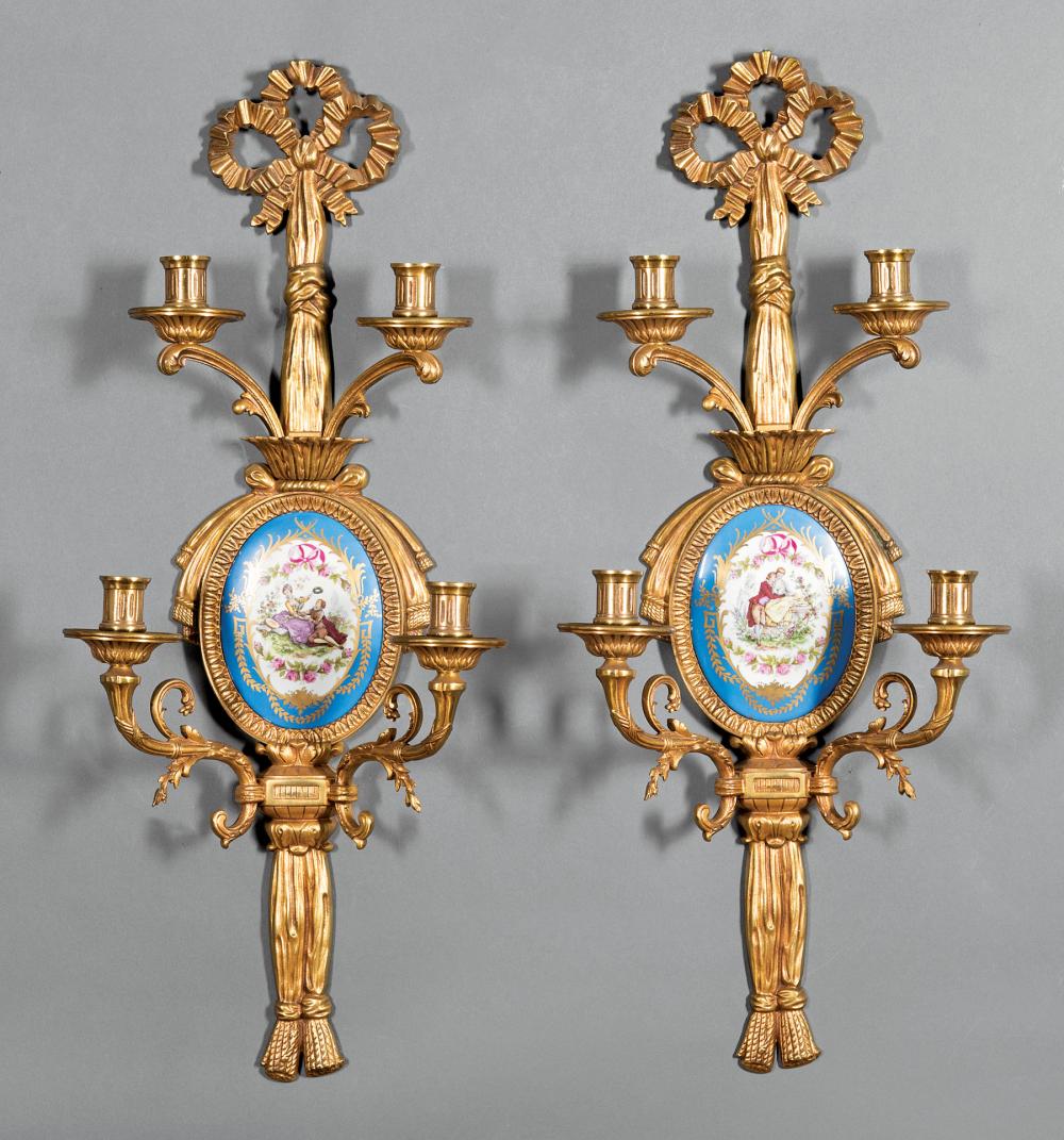 Appraisal: Pair of French Porcelain-Mounted Bronze Four-Light Sconces th c ribbon-form