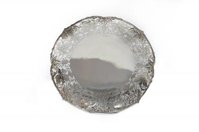 Appraisal: A silver salver Mappin Webb Sheffield the border pierced and