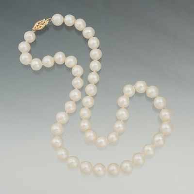 Appraisal: A Princess Length Pearl Necklace with Gold Clasp k yellow