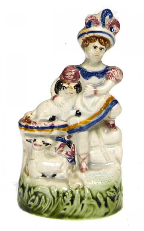 Appraisal: A PEARLWARE MINIATURE GROUP OF A CHILD LAP DOG AND