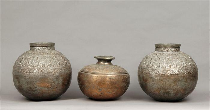 Appraisal: Pair of Middle Eastern Hammered Copper Jars Together with another