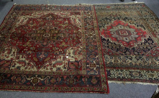 Appraisal: An Oriental rug with indigo medallion on a madder ground