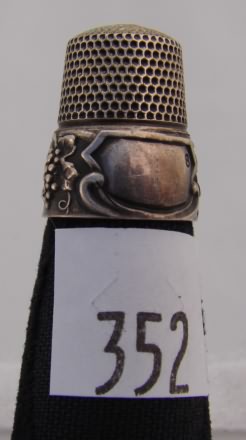 Appraisal: Simons thimble with grapevine design on wide band